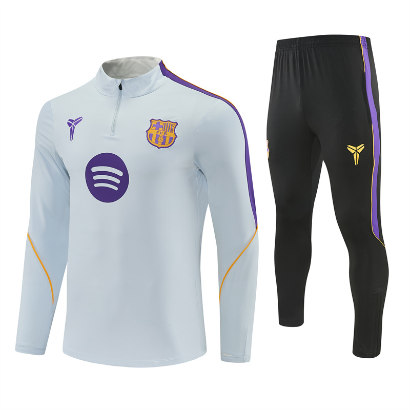 Mens Barcelona Training Suit Light Grey 2026/27 Mens Barcelona training suit with purple shoulder panels and black trousers front view