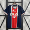 Mens PSG Retro Home Jersey 1974/75 on hanger showing navy body with central red Hechter stripe and Canada Dry sponsor