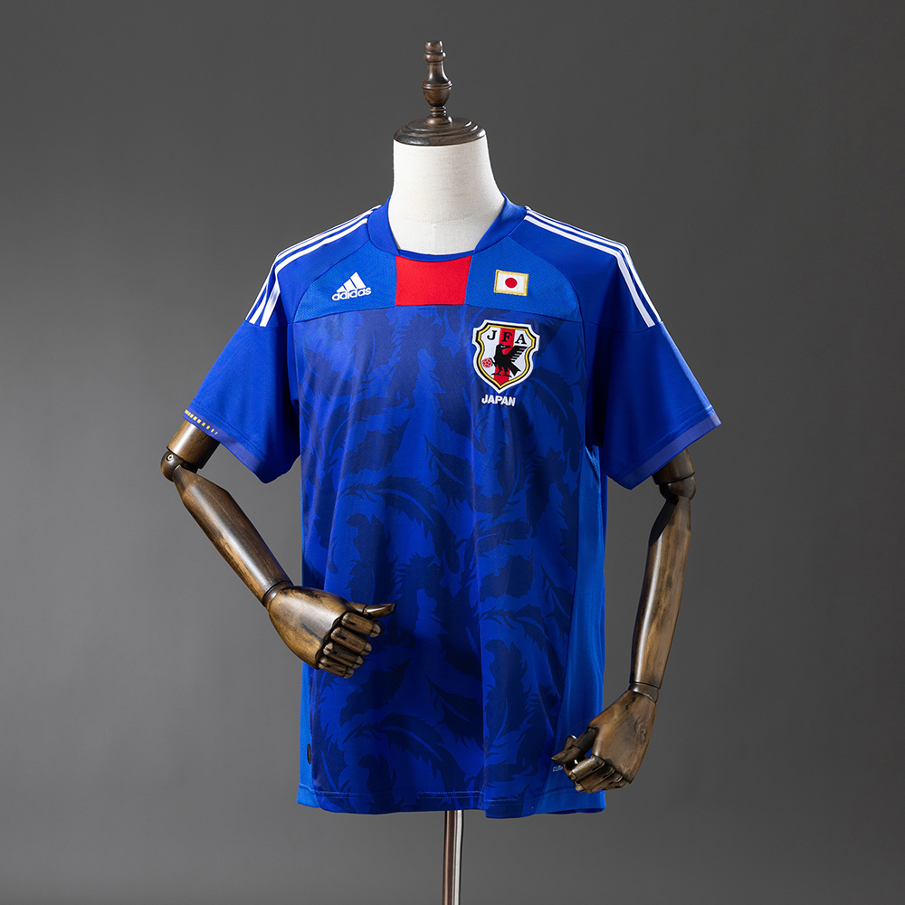 Mens World Cup Japan Retro Home Jersey 2010 Mens World Cup Japan Retro Home Jersey 2010 on mannequin showing samurai blue base and red throat insert