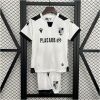 Kids Vitoria SC Home Kit 2025/26 on rack showing white embossed jersey with black accents and matching white shorts