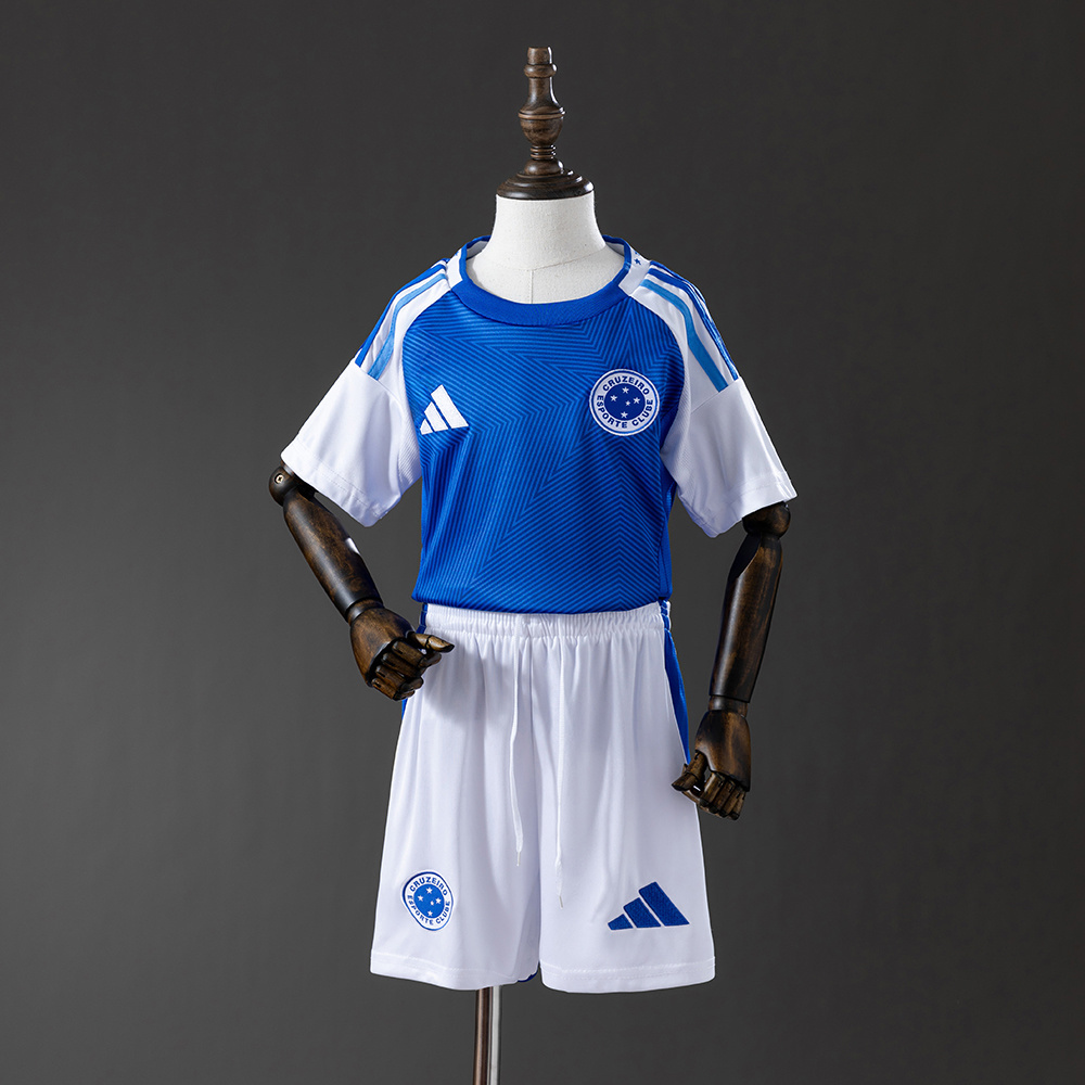 Kids Cruzeiro Home Kit 2025/26 Kids Cruzeiro Home Kit 2025/26 front view showing blue jersey and white shorts