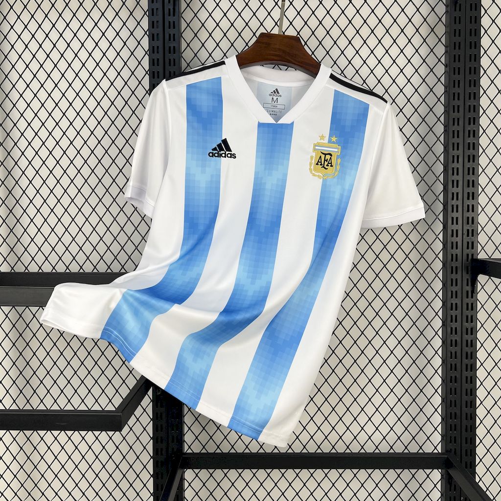 Mens World Cup Argentina Retro Home Jersey 2018 Mens World Cup Argentina Retro Home Jersey 2018 on hanger showing pixelated sky blue stripes and AFA crest