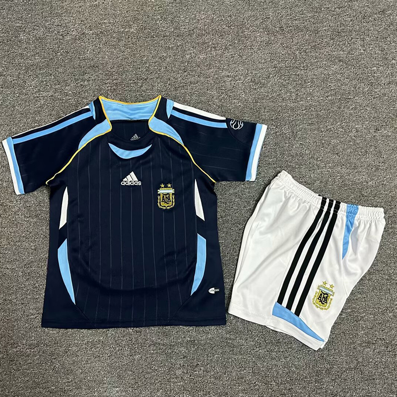 Kids World Cup Argentina Retro Away Kit 2006 Kids World Cup Argentina Retro Away Kit 2006 laid flat showing navy Teamgeist jersey and white shorts