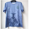 Mens Brazil Blue Jesus Edition Jersey 2025 on hanger showing sky blue body with Rio panorama and Christ statue