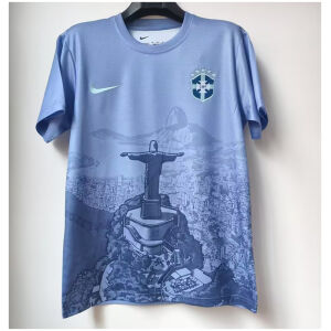 Mens Brazil Blue Jesus Edition Jersey 2025 on hanger showing sky blue body with Rio panorama and Christ statue