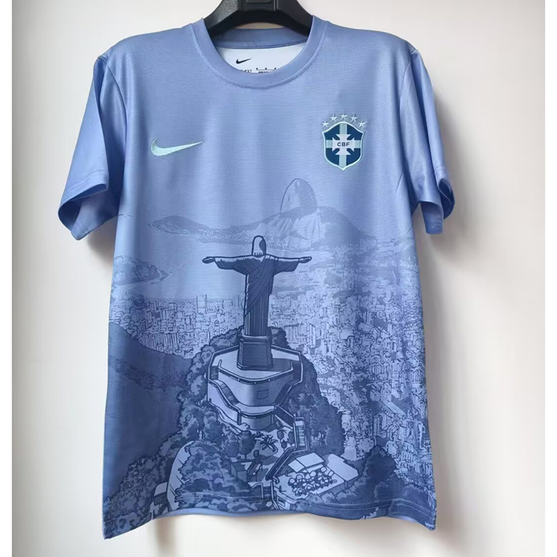 Mens Brazil Blue Jesus Edition Jersey 2025 Mens Brazil Blue Jesus Edition Jersey 2025 on hanger showing sky blue body with Rio panorama and Christ statue