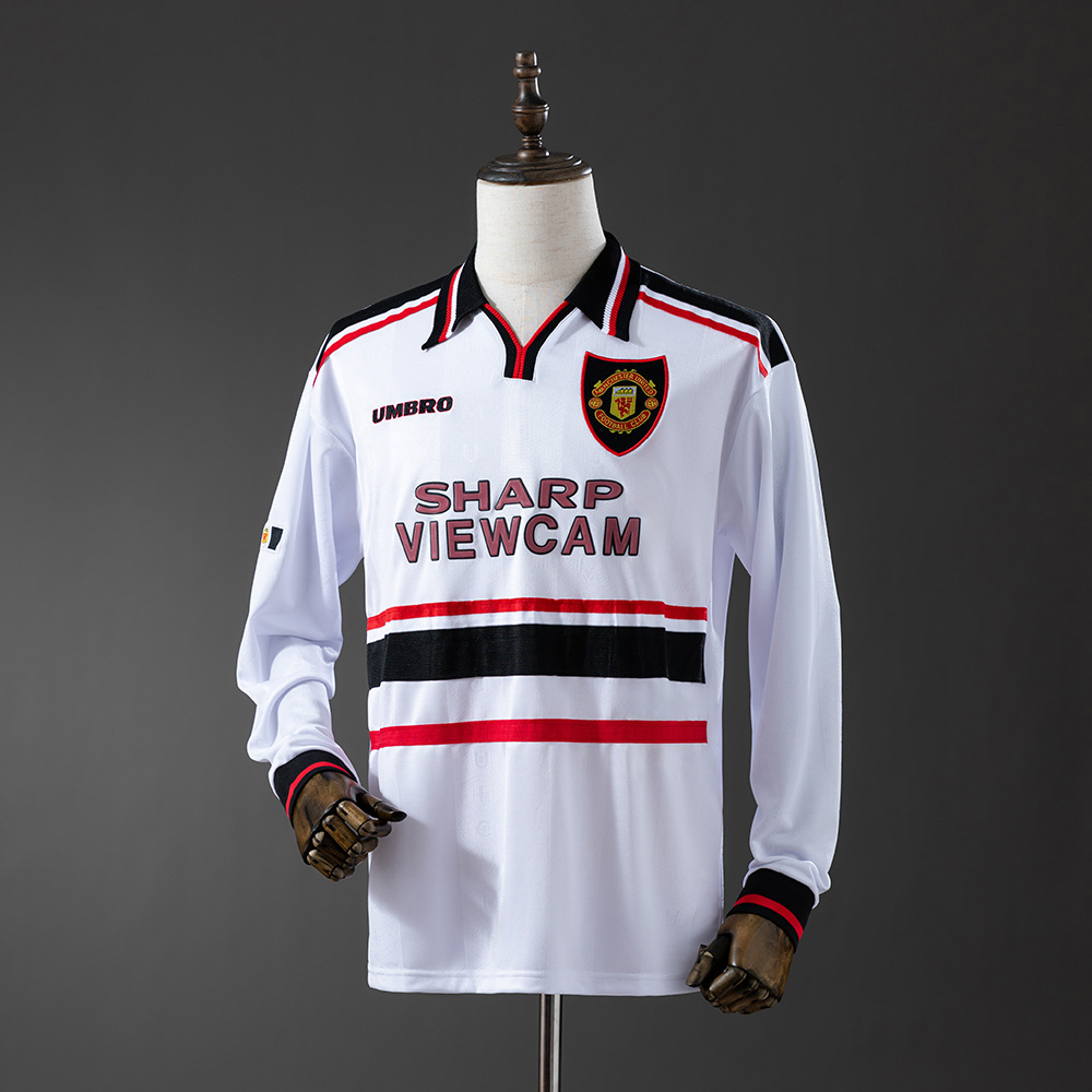 Mens Manchester United Retro Long Sleeve Away Jersey 1998/99 Mens Manchester United Retro Long Sleeve Away Jersey 1998/99 on mannequin showing white body with chest bands