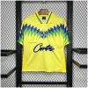 Mens Brazil Corteiz Retro Home Jersey 1995 on hanger showing yellow body with blue and green chevron pattern