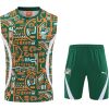 Front view of the Mens Cote d’Ivoire Training Singlet Kit 2025 with green and orange tribal patterns and shorts