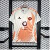 Mens Roma Away Jersey 2024/25 on hanger showing off-white body with orange spray-paint graphic