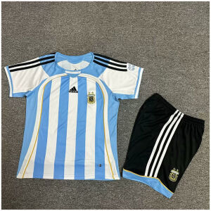 Kids World Cup Argentina Retro Home Kit 2006 laid flat showing Teamgeist jersey and black shorts