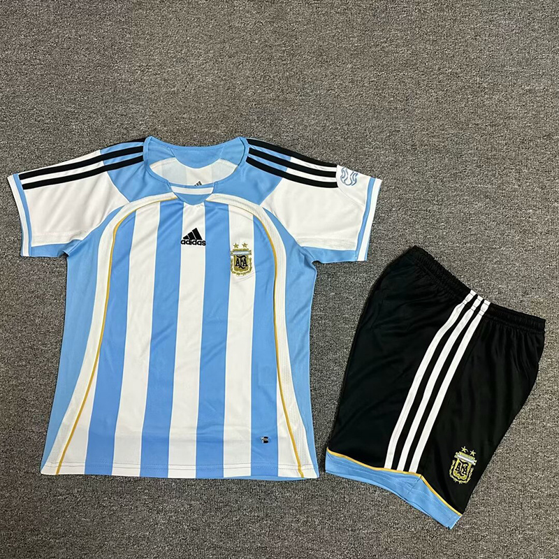 Kids World Cup Argentina Retro Home Kit 2006 Kids World Cup Argentina Retro Home Kit 2006 laid flat showing Teamgeist jersey and black shorts