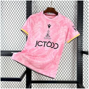 Mens Bradford City Third Jersey 2025/26 on rack showing rose pink body with abstract typography pattern and centered Bantam crest