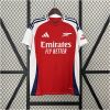 Mens Arsenal Home Jersey 2024/25 on display showing red body with white raglan sleeves, navy side inserts, and cannon crest