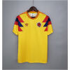 Mens Colombia yellow Retro Home Jersey 1990 front view on hanger showing yellow body and geometric shoulder panels