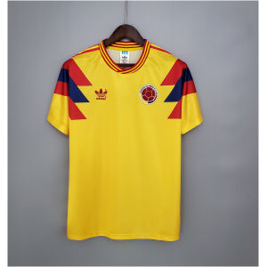 Mens Colombia yellow Retro Home Jersey 1990 front view on hanger showing yellow body and geometric shoulder panels