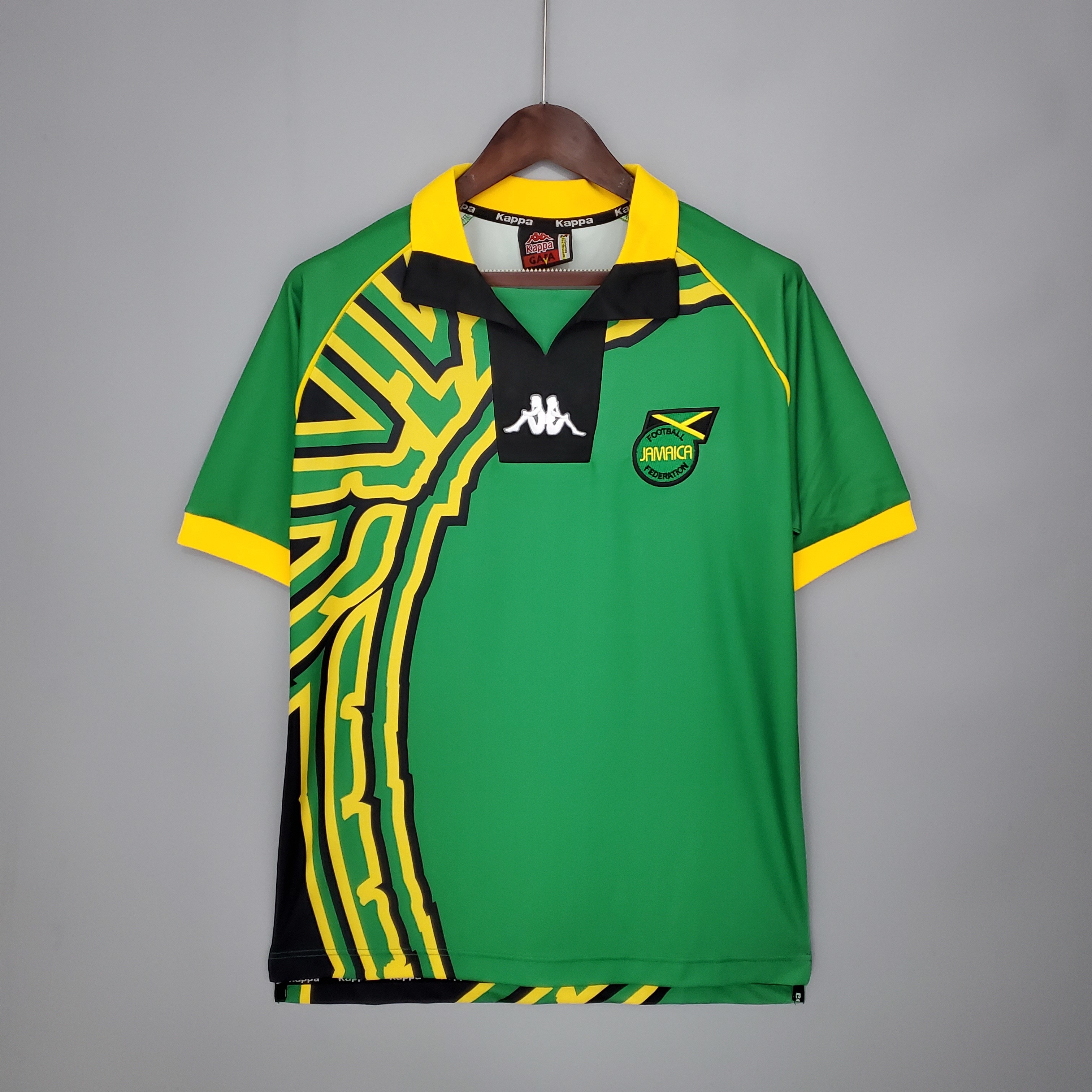 Mens World Cup Jamaica Retro Away Jersey 1998 Mens World Cup Jamaica Retro Away Jersey 1998 on mannequin showing green body and yellow tribal panel