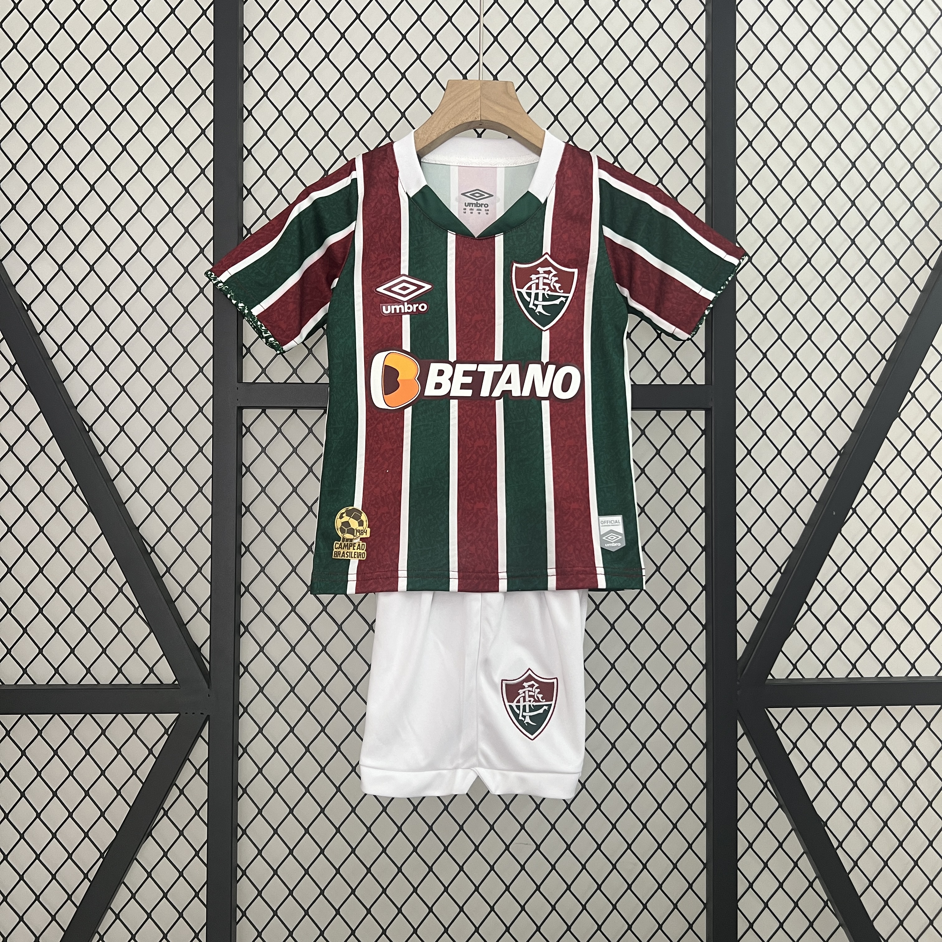 Kids Fluminense Home Kit 2024/25 Kids Fluminense Home Kit 2024/25 front view on display