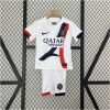 Kids PSG Away Kit 2024/25 featuring white youth away jersey with Eiffel Tower graphic and matching shorts