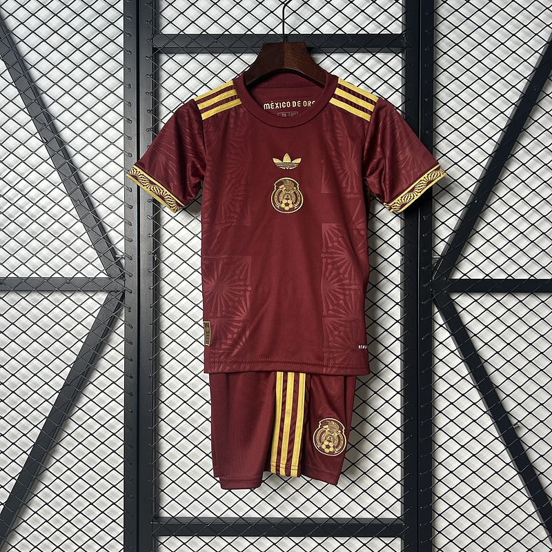Kids Mexico Red Gold Cup Kit 2025 Kids Mexico Red Gold Cup Kit 2025 on hanger showing maroon jersey with gold crest and matching shorts
