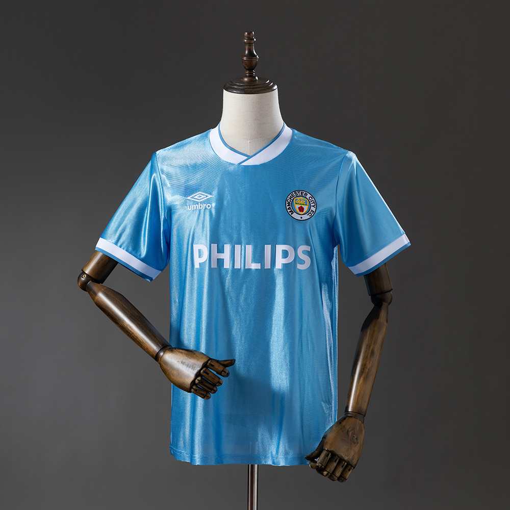 Mens Manchester City Retro Home Jersey 1986/87 Mens Manchester City Retro Home Jersey 1986/87 on mannequin showing sky blue body with white V-neck and PHILIPS sponsor