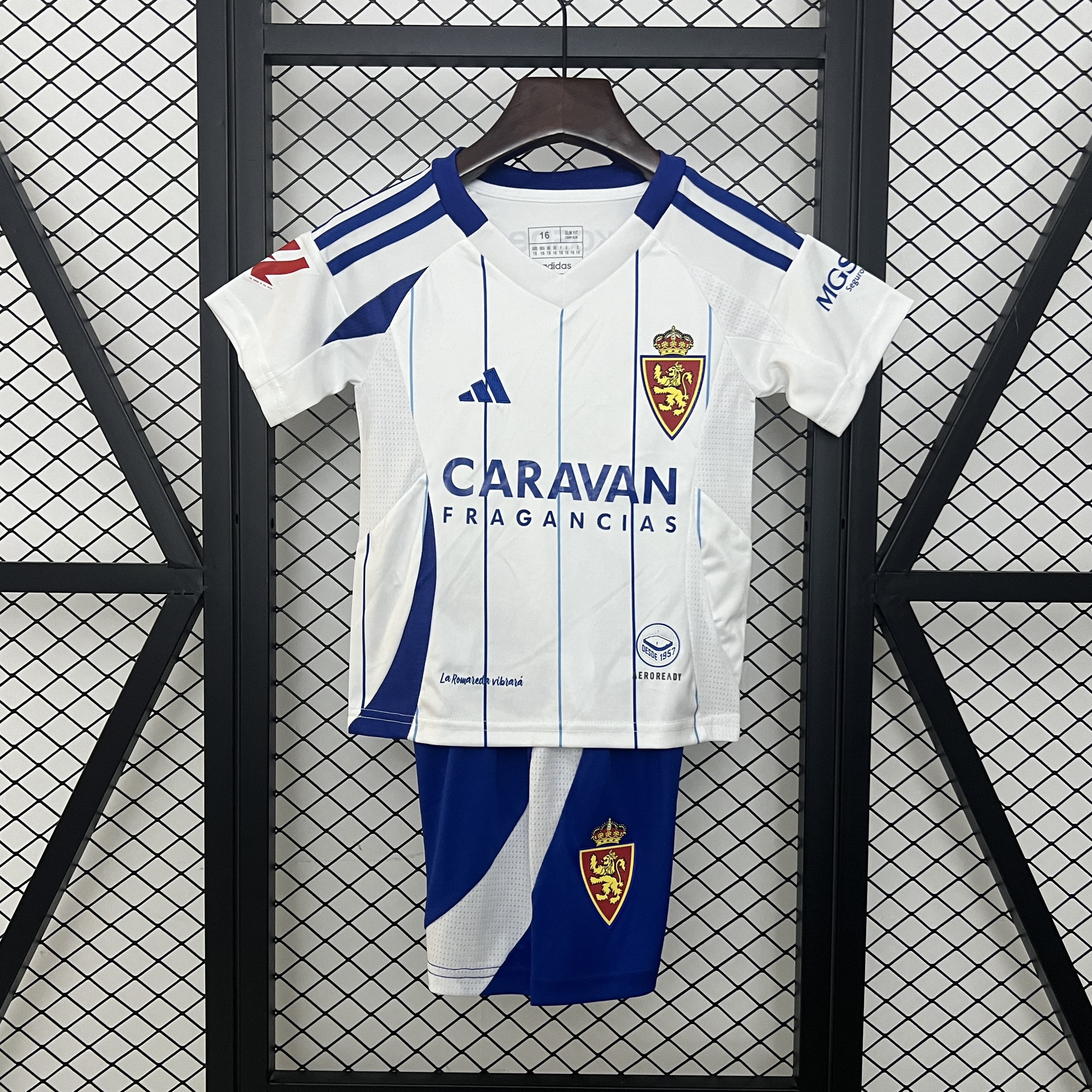Kids Real Zaragoza Home Kit 2024/25 Kids Real Zaragoza Home Kit 2024/25 front view on display