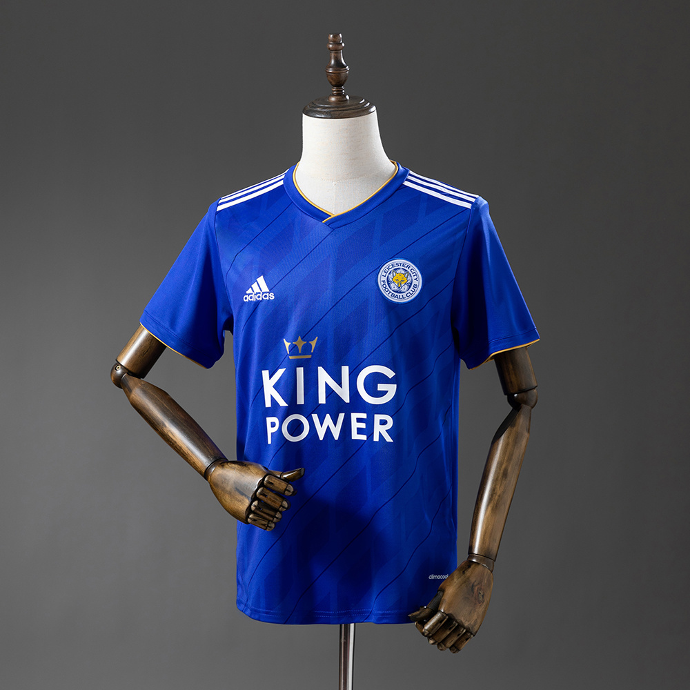 Mens Leicester City Retro Home Jersey 2018/19 Mens Leicester City Retro Home Jersey 2018/19 on mannequin showing royal blue body with diagonal shadow graphics and KING POWER