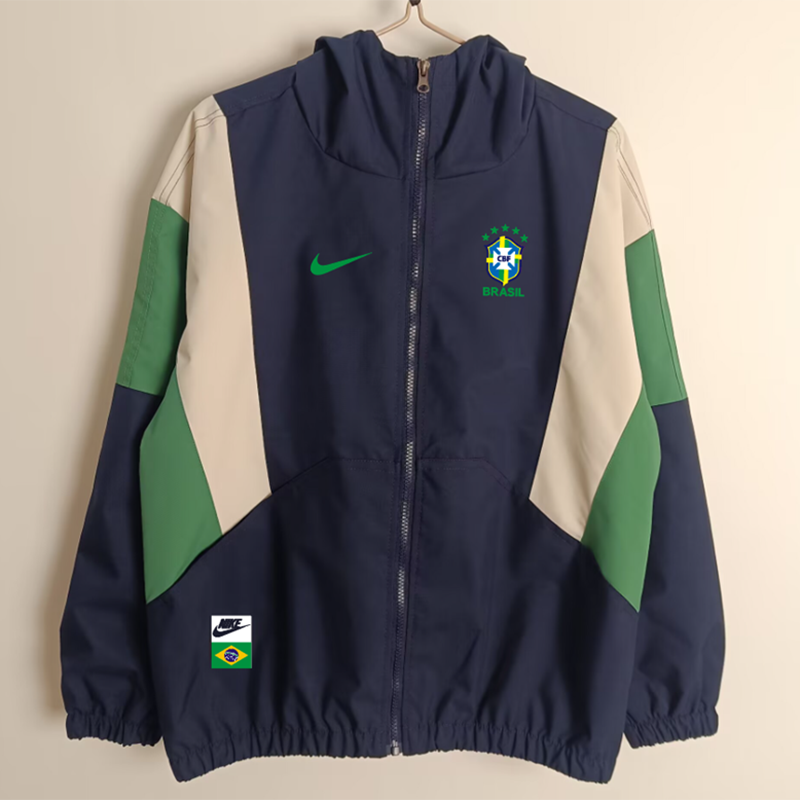 Mens Brazil Sapphire Windbreaker 2025 Mens Brazil Sapphire Windbreaker 2025 on hanger showing navy jacket with sand and green chevron blocks