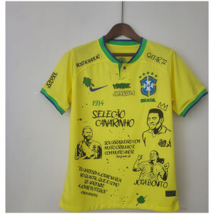 Mens World Cup Brazil Court Graffiti Board Home Jersey 2022 on hanger showing yellow jersey with graffiti portraits