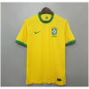 Mens Brazil yellow Retro Home Jersey 2020 on hanger showing canary yellow body with diamond green collar