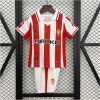 Kids Sporting Gijon Home Kit 2025/26 front view on display