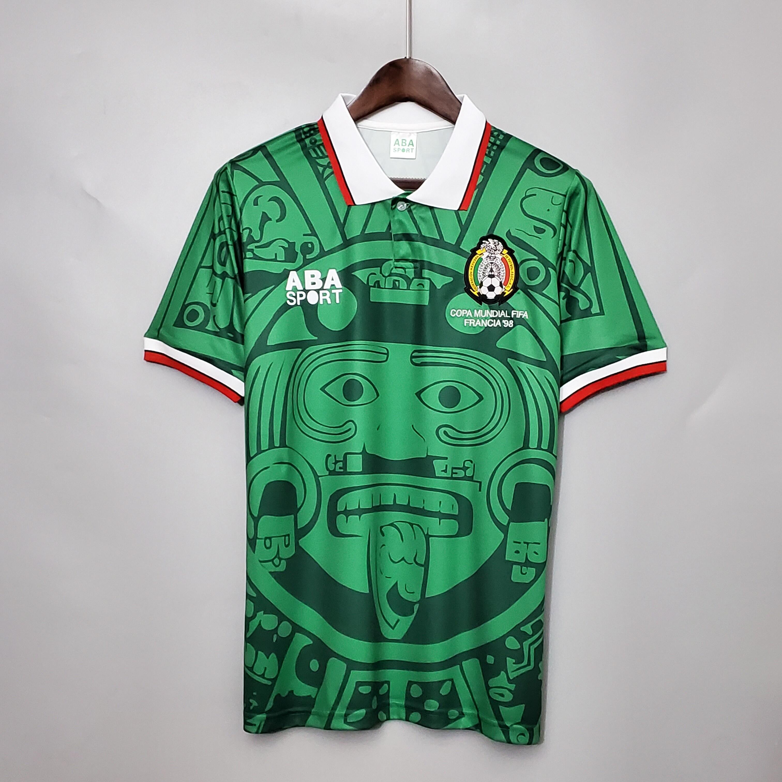 Mens World Cup Mexico Retro Home Jersey 1998 Mens World Cup Mexico Retro Home Jersey 1998 on mannequin showing green base and Aztec Sun Stone