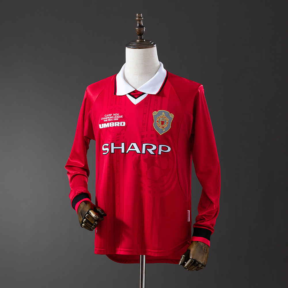 Mens Manchester United Retro Long Sleeve Home Jersey 1999/00 Mens Manchester United Retro Long Sleeve Home Jersey 1999/00 on mannequin showing red body with Camp Nou embroidery