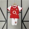 Kids Arsenal Retro Home Kit 2002/04 on rack showing red and white jersey with matching white shorts and O2 logo