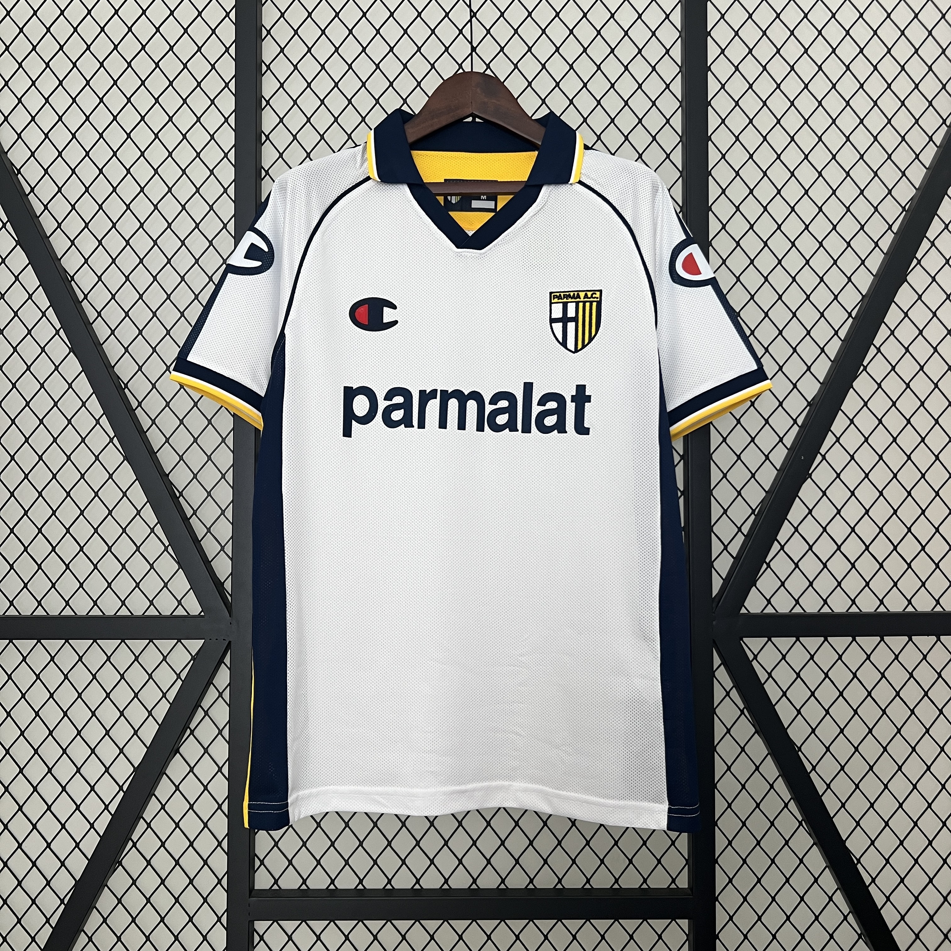 Mens Parma Retro Away Jersey 2003/04 Mens Parma Retro Away Jersey 2003/04 on hanger showing white body with navy side panels and yellow piping