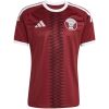 Mens Qatar World Cup Home Jersey 2026 maroon shirt front view with serrated center stripe