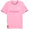 Solid pink Palermo home shirt with black-trimmed collar and sleeve hems front view