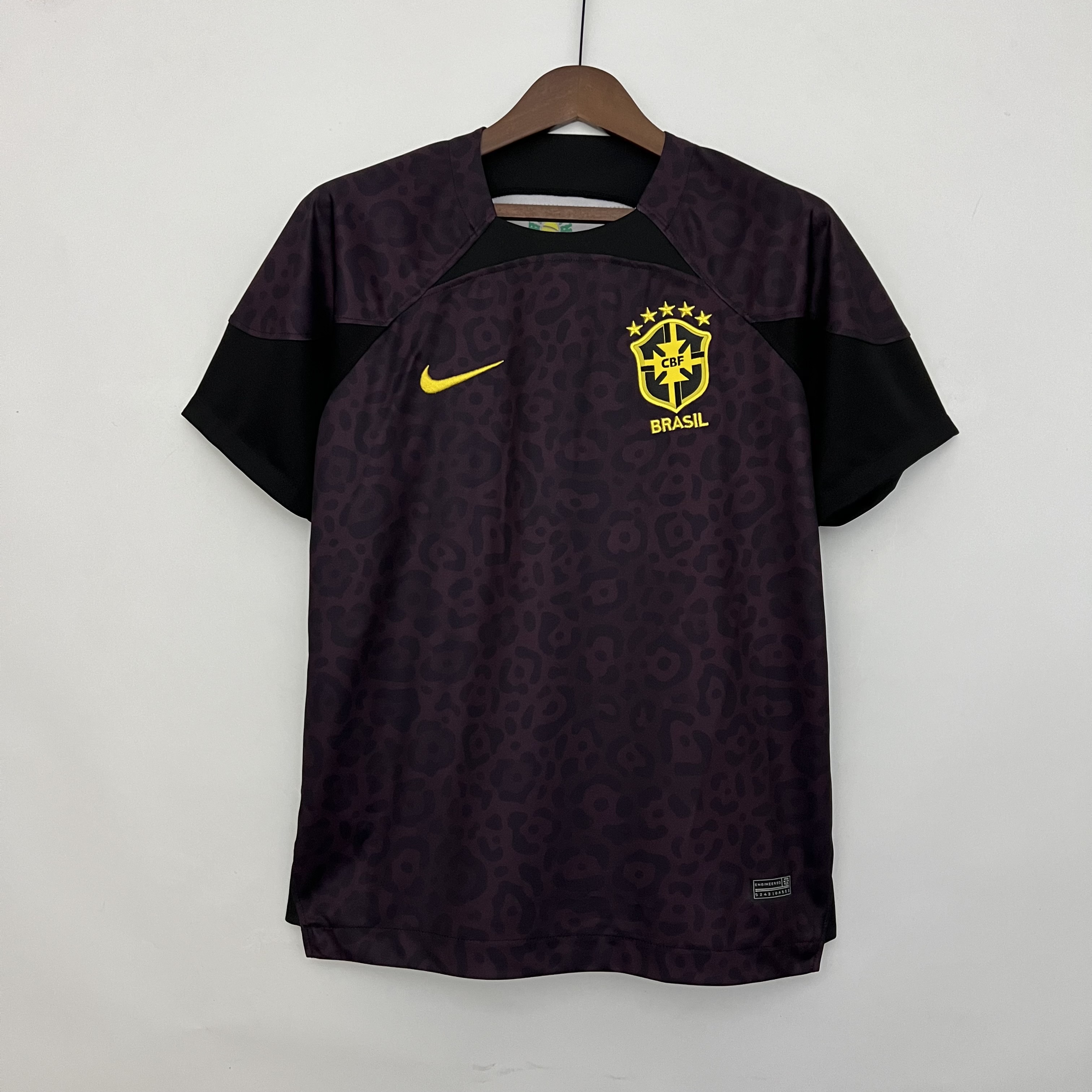 Mens World Cup Brazil Brown Goalkeeper Jersey 2022 Mens World Cup Brazil Brown Goalkeeper Jersey 2022 on hanger showing brown body with jaguar rosette print