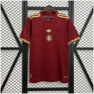 Mens Mexico red Gold Cup special Jersey 2025 on hanger showing maroon fabric with gold Aztec pattern