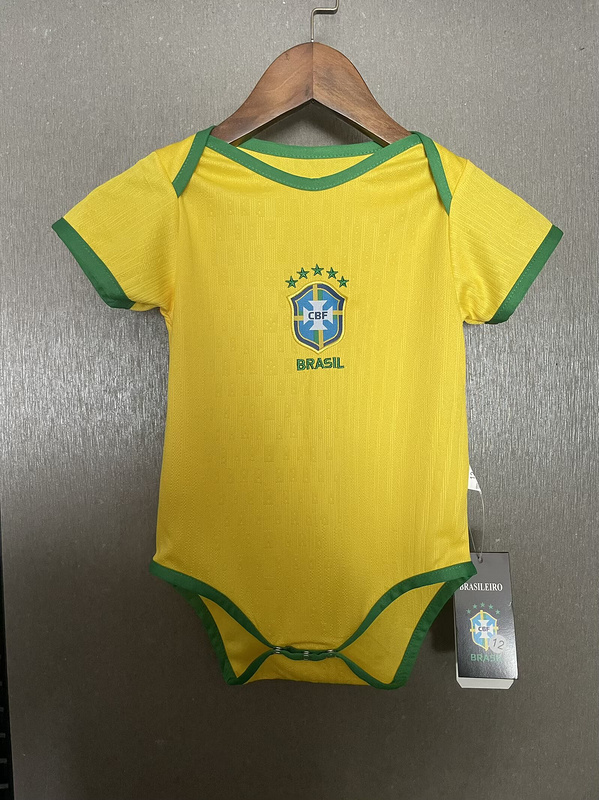 Baby Brazil Home Jersey 2025 Baby Brazil Home Jersey 2025 front view on hanger showing canary yellow bodysuit and green trim