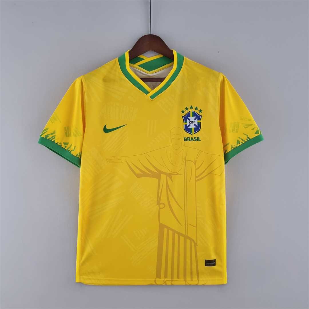 Mens World Cup Brazil Classic Yellow Jersey 2022 Mens World Cup Brazil Classic Yellow Jersey 2022 on hanger showing yellow body with Christ line art
