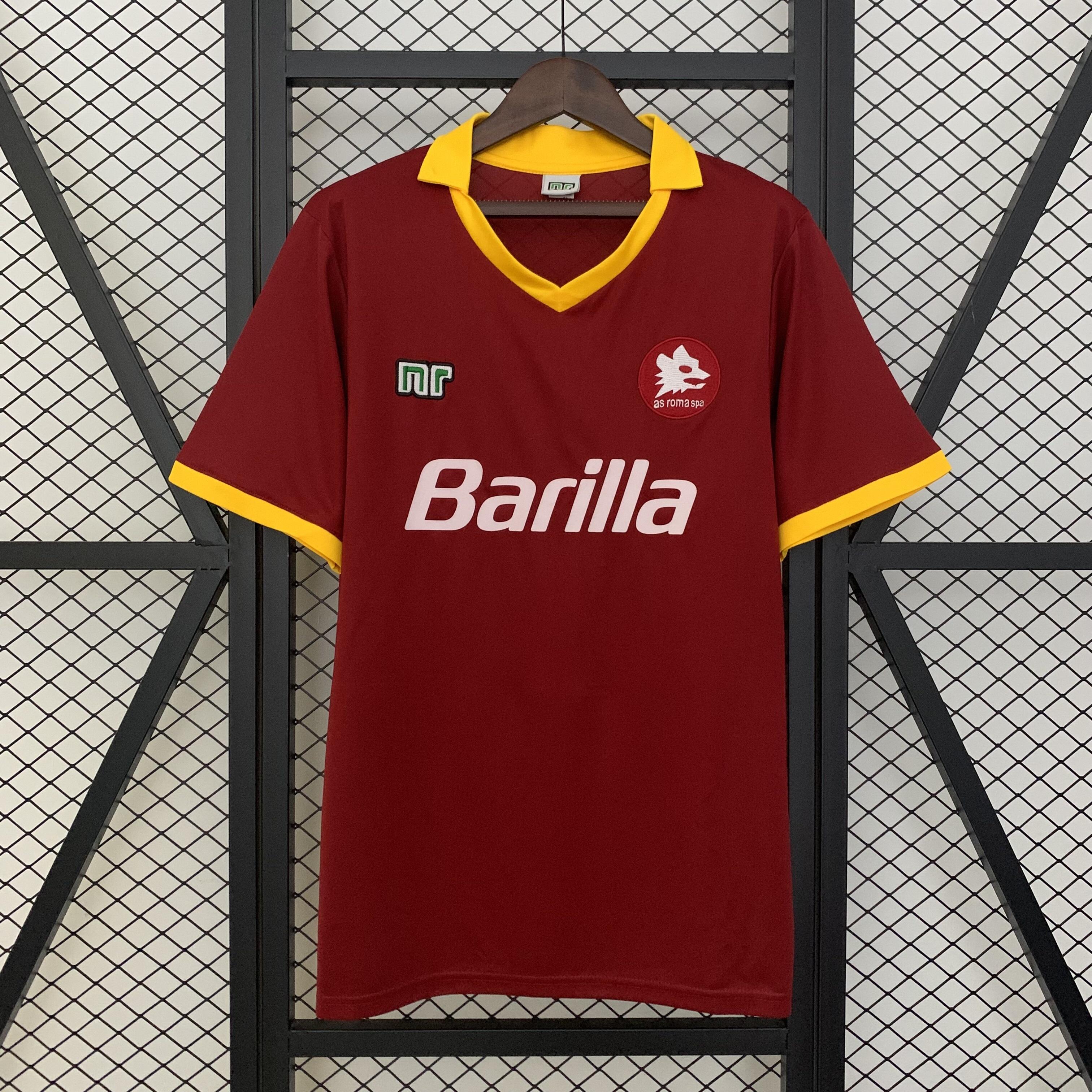 Mens Roma Retro Home Jersey 1989/90 Mens Roma Retro Home Jersey 1989/90 on hanger showing carmine red body and yellow polo collar