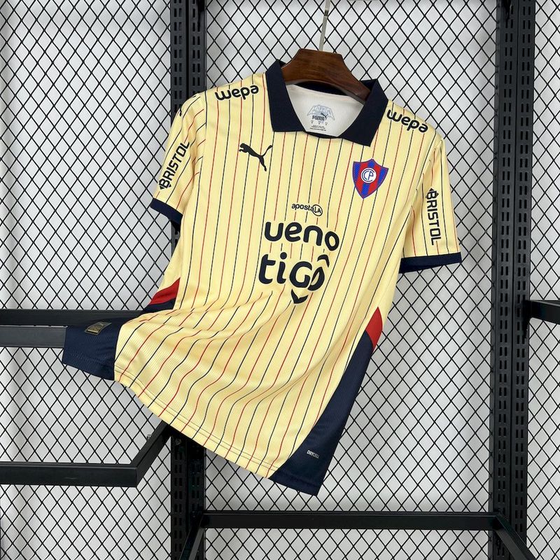 Mens Cerro Porteno Away Jersey 2025/26 Mens Cerro Porteno Away Jersey 2025/26 on display showing cream body with navy and red pinstripes and dark polo collar