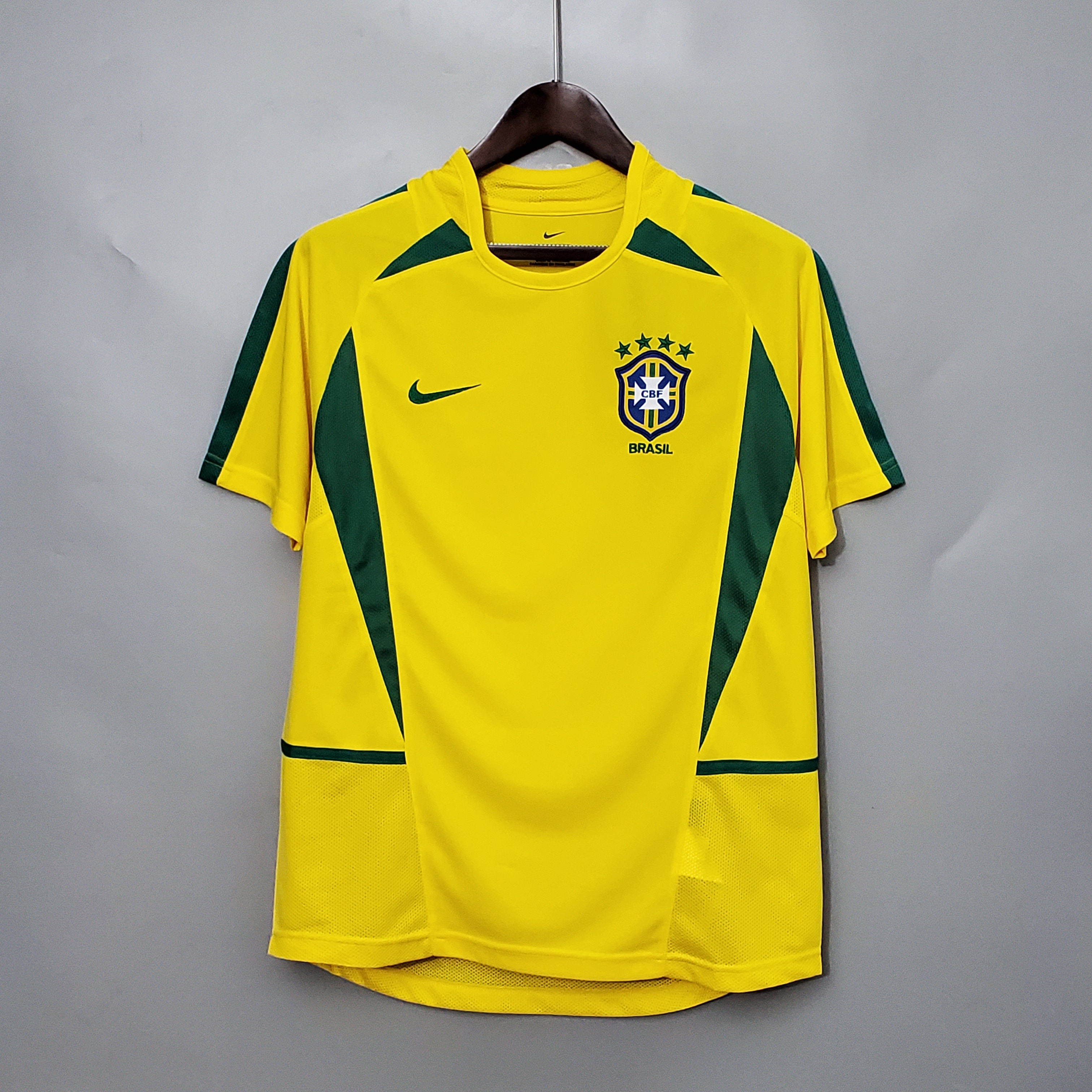 Mens World Cup Brazil Retro Home Jersey 2002 Mens World Cup Brazil Retro Home Jersey 2002 on hanger showing yellow body with green curved side panels