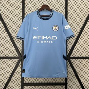 Mens Manchester City Home Jersey 2024/25 on hanger showing sky blue body with navy 0161 collar and white sponsor