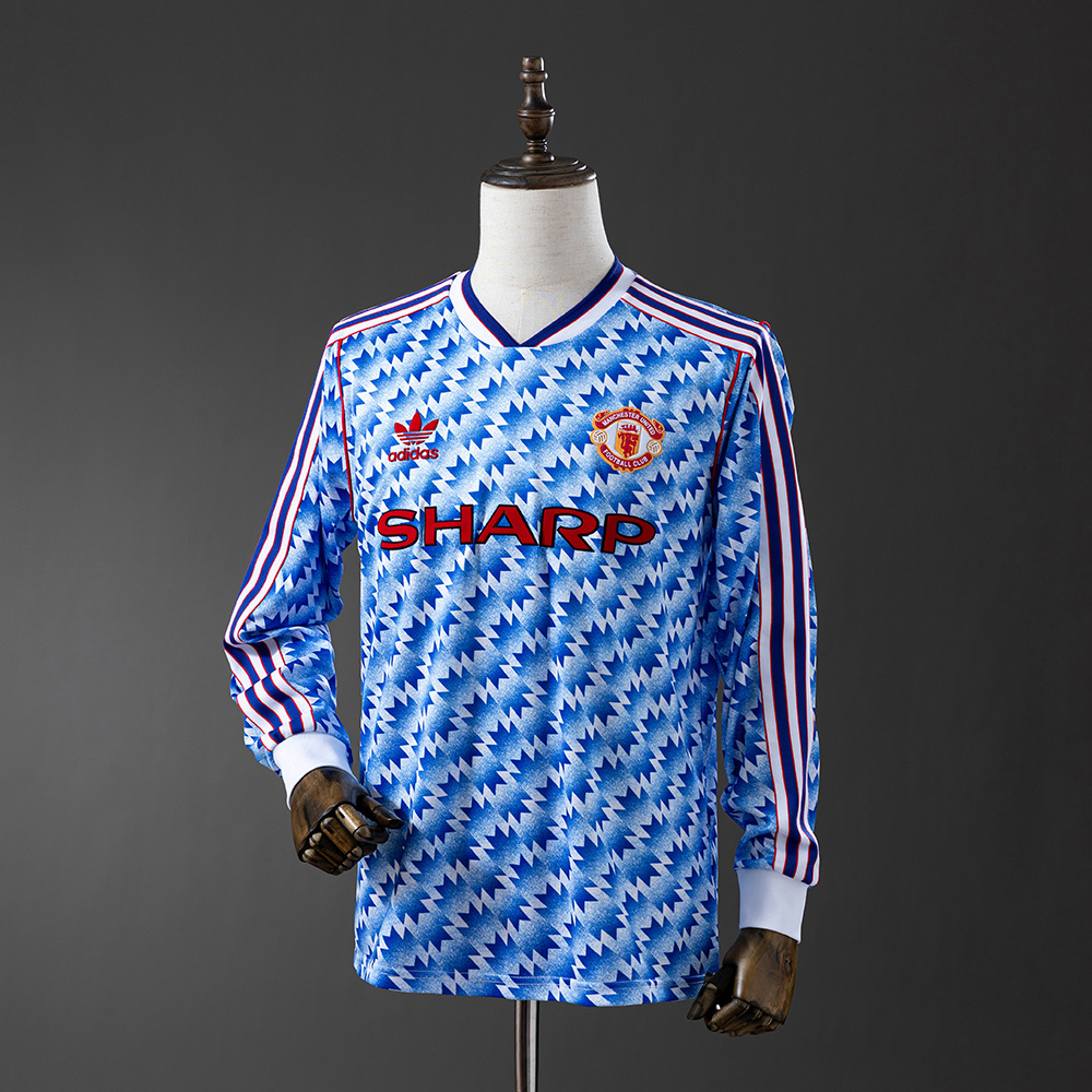 Mens Manchester United Retro Long Sleeve Away Jersey 1990/92 Mens Manchester United Retro Long Sleeve Away Jersey 1990/92 on mannequin showing blue-white snowflake mosaic pattern