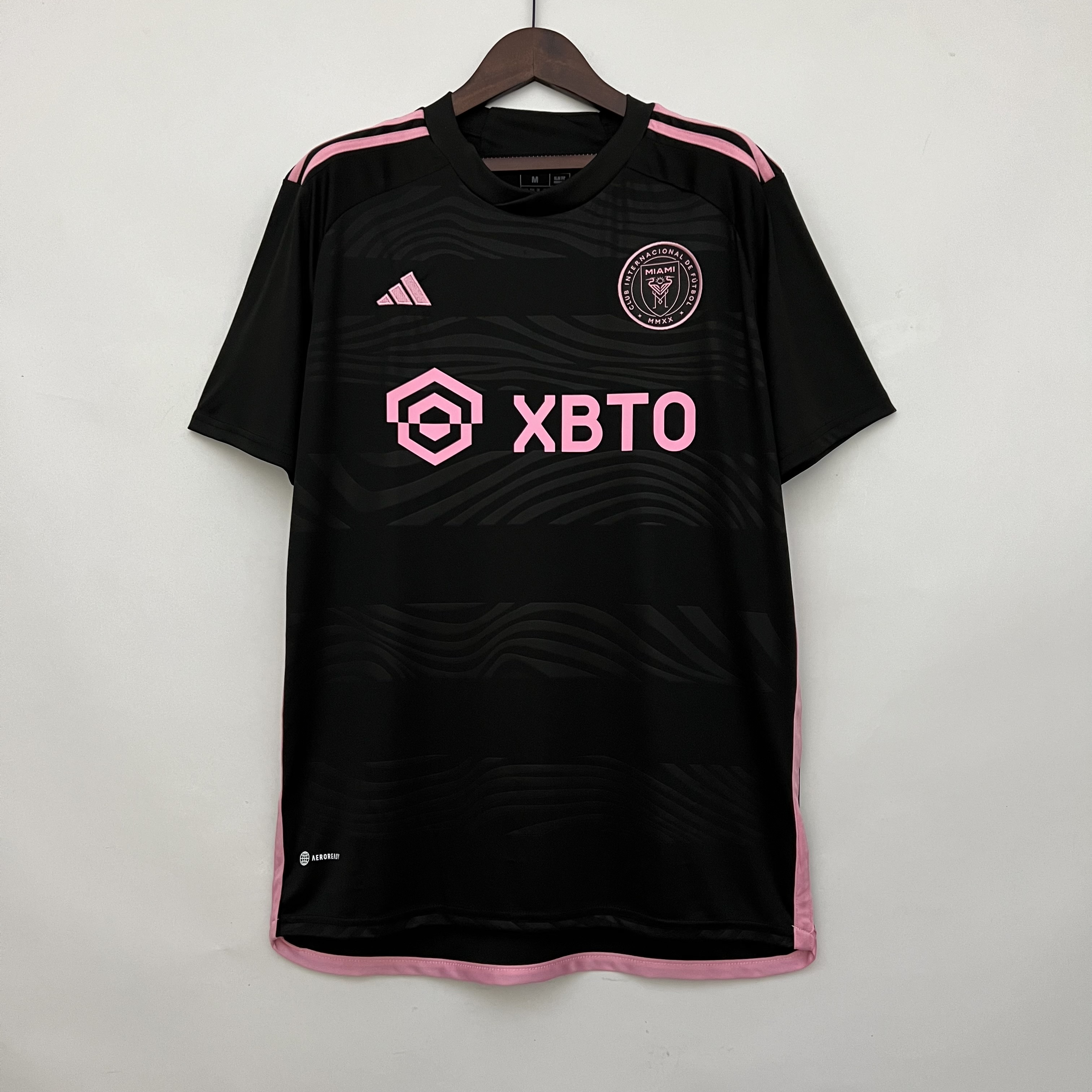 Mens Inter Miami Away Jersey 2023/24 Mens Inter Miami Away Jersey 2023/24 black shirt showing pink crest and XBTO sponsor