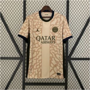 Mens PSG Fourth Jersey 2023/24 on hanger showing sand elephant print body with olive logos and navy collar