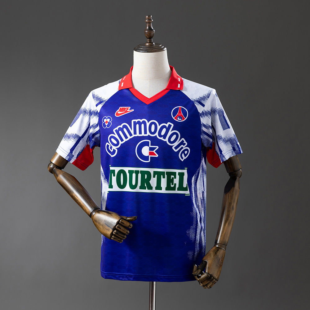Mens PSG Retro Away Jersey 1992/93 Mens PSG Retro Away Jersey 1992/93 on hanger showing royal blue body with spray pattern sleeves and Commodore branding