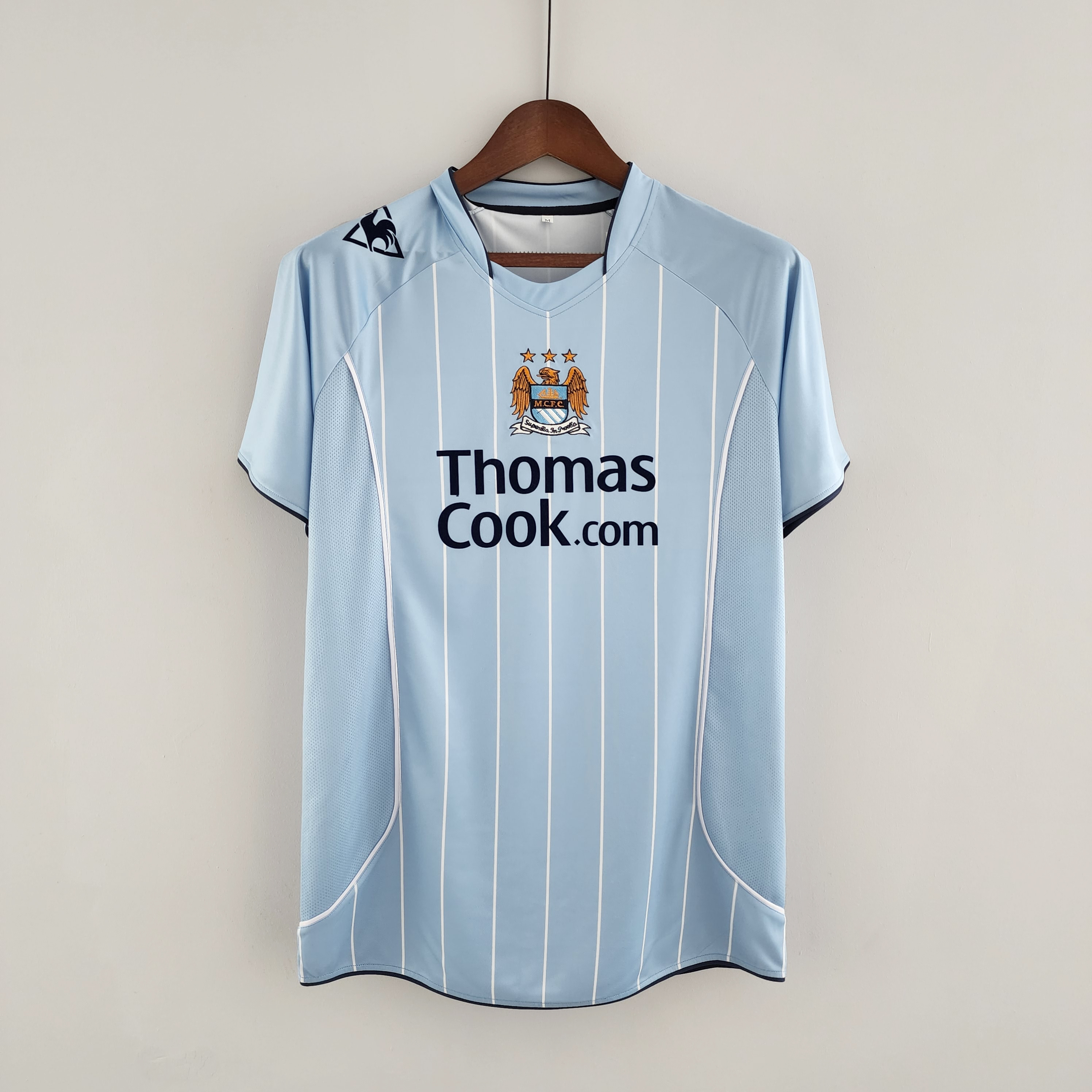 Mens Manchester City Retro Home Jersey 2008/09 Mens Manchester City Retro Home Jersey 2008/09 on hanger showing sky blue body with white pinstripes and navy sponsor